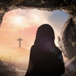 Resurrection of Easter Sunday  concept: Jesus Christ with empty tomb stone with cross on sunrise background