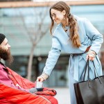 woman giving money for a homeless beggar 2023 11 27 05 22 39 utc