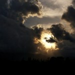 storm clouds surrounding sun
