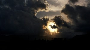 storm clouds surrounding sun